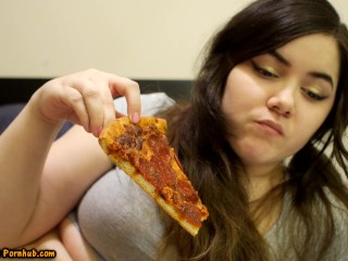 Bored Girl Chews On Pizza