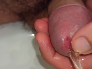 close up pissing and playing with peehole