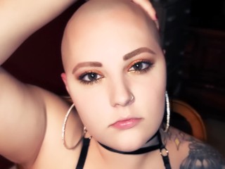 Bald Babe rubs her head