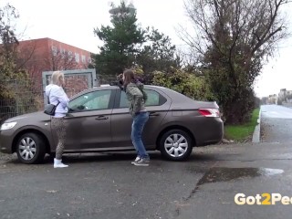 Blonde And Brunette Squat And Piss Together