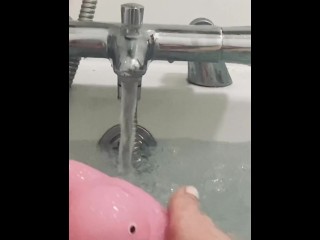 My feet in the bath playing with my rubber duck 