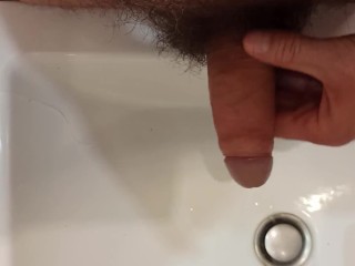 Jerking off, peeing, jerking off and washing my dick in the bathroom.