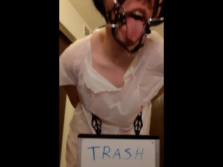 Whore in trash bag drools with humiliation