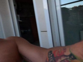 Fucking a tattooed girl on the balcony with a cumshot on a smiling face