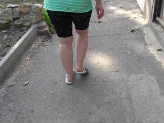 BBW in flip flops walks along the sidewalk while a voyeur peeps on her feet Public foot fetish