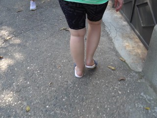 BBW in flip flops walks along the sidewalk while a voyeur peeps on her feet Public foot fetish