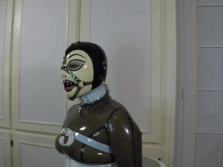 Trailer Miss Maskerade Bound In Full Rubber Latex Catsuit