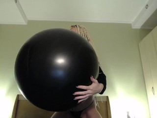 Blow big black balloon & pop with nails