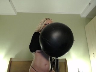 Blow big black balloon & pop with nails