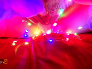 Snow Maiden brings herself to orgasm in Christmas lights