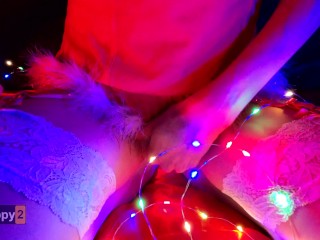 Snow Maiden brings herself to orgasm in Christmas lights