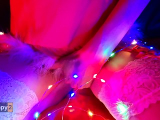 Snow Maiden brings herself to orgasm in Christmas lights