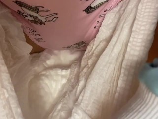 By the Christmas tree pissing in cute panties under a diaper