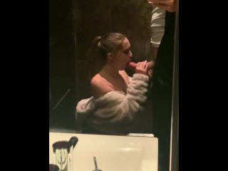 Goregous gal gags on giant cock in grand public bathroom