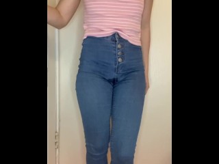 Silly girl pee in jeans while standing