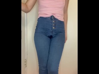 Silly girl pee in jeans while standing