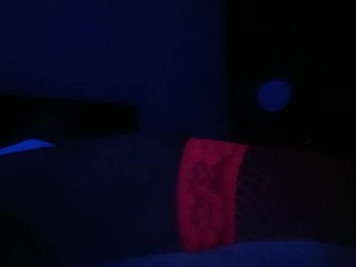 Crossdresser streaptease under UV light 