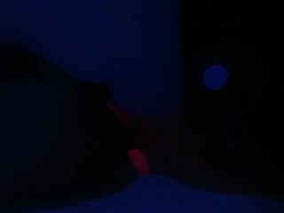 Crossdresser streaptease under UV light 