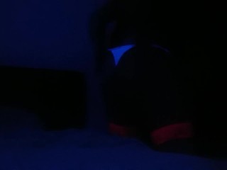 Crossdresser streaptease under UV light 