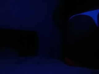 Crossdresser streaptease under UV light 