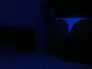 Crossdresser streaptease under UV light 