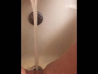 Horny hot thick MILF wiggles hips and uses bath tub faucet to get off in bathtub