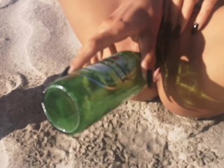 Lucky Heineken bottle found at the beach got into my Juicy Pussy. Do you like my pissed lingerie? 