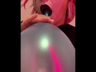 naughty clown girl blows up balloons & stuffs them in her pussy