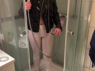 Amateur girl Leather jacket and white pants getting soaking wet in the shower