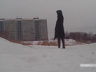 Winter street photoshoot in a fur coat on a naked body