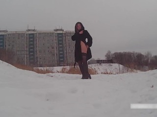 Winter street photoshoot in a fur coat on a naked body