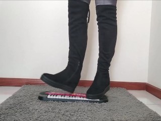 Crushing a toy with my sexy boots