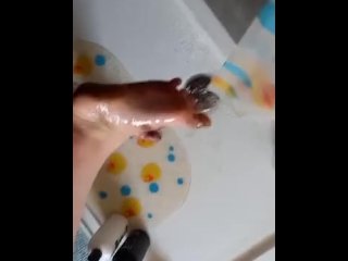 Washing dirty feet in the shower 
