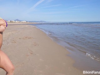 Micro bikini model flashing her huge tits on the beach