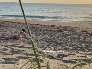 Spying hot MILF touching at the beach
