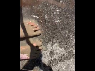 Cleaning my muddy feet with hose