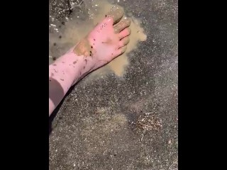 Cleaning my muddy feet with hose