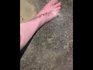 Cleaning my muddy feet with hose