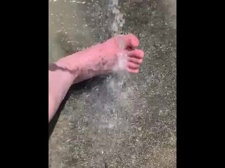 Cleaning my muddy feet with hose