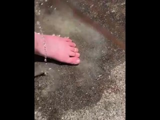 Cleaning my muddy feet with hose