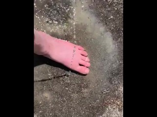 Cleaning my muddy feet with hose