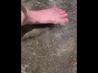 Cleaning my muddy feet with hose