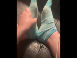 Rubbing feet and taking off socks