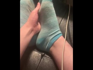 Rubbing feet and taking off socks