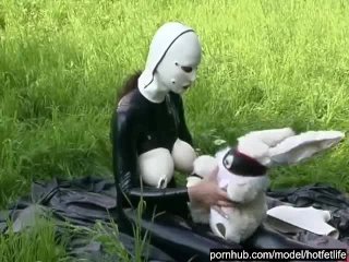 Rubber Girl Full in Black Latex Catsuit and Mask Plays with herself Outdoor in a Meadow - Part 3