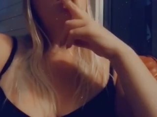 Big Ass tits smoking a cigarette outside 