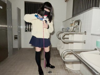 A high school girl wearing a chastity piercing masturbates anally in a men's public restroom.