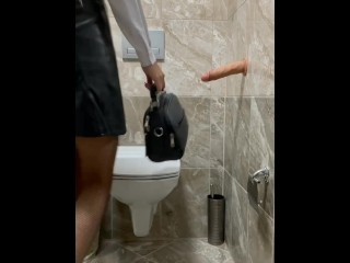 went into the toilet saw a dildo and could not resist the temptation to start fucking herself