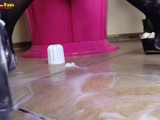 Brunette in pantyhose gives footjob to a cream tube