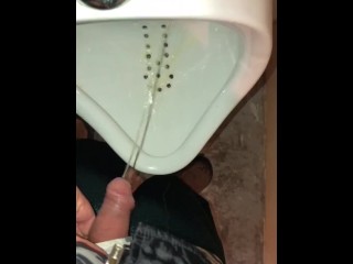 Girl Pissing into a Urinal & her Husband gets to Witness it first hand as he pisses right after her